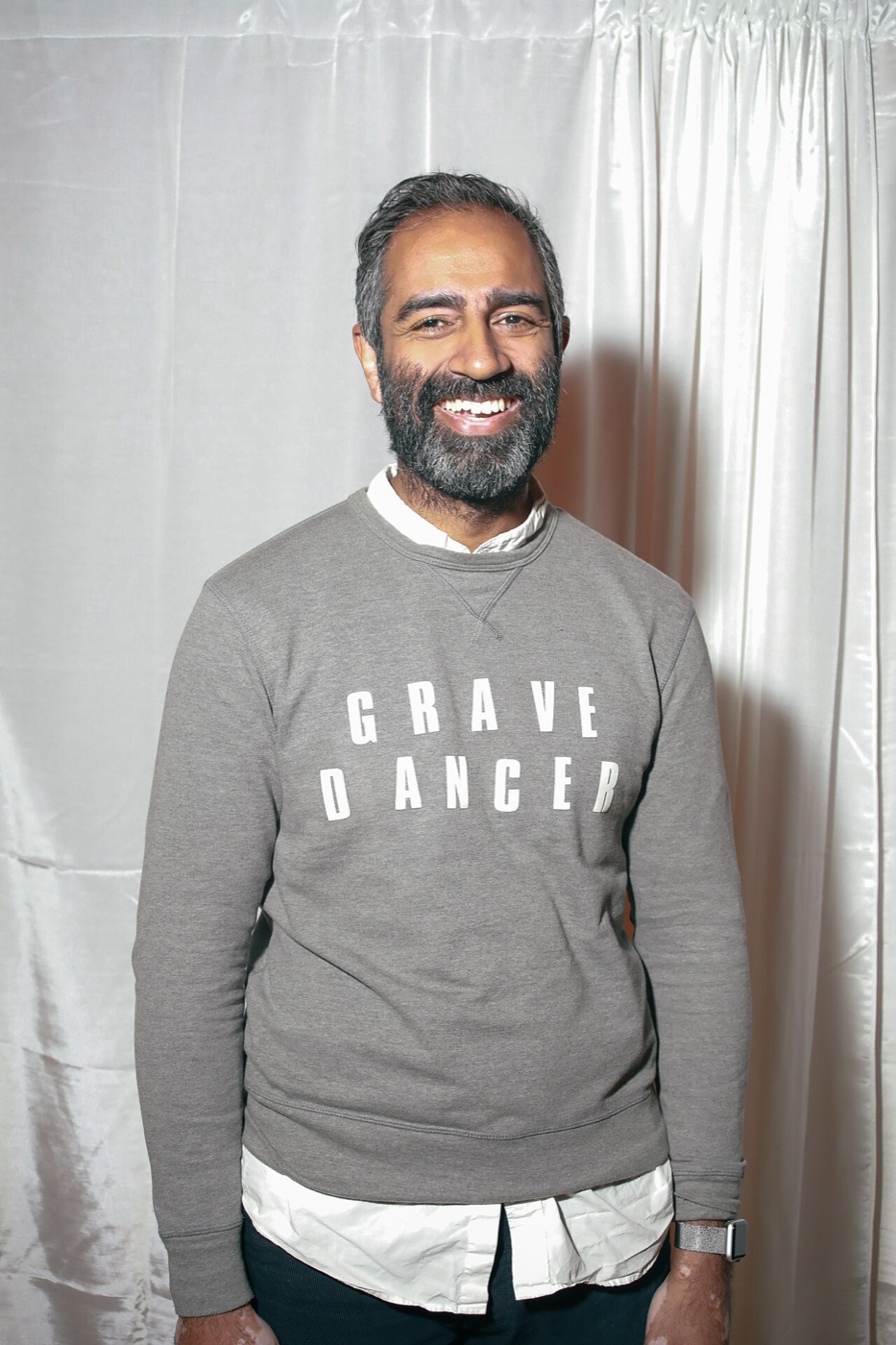 Amol Sarva smiling in the Grave Dancer shirt